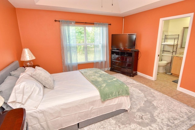 tiled bedroom with connected bathroom