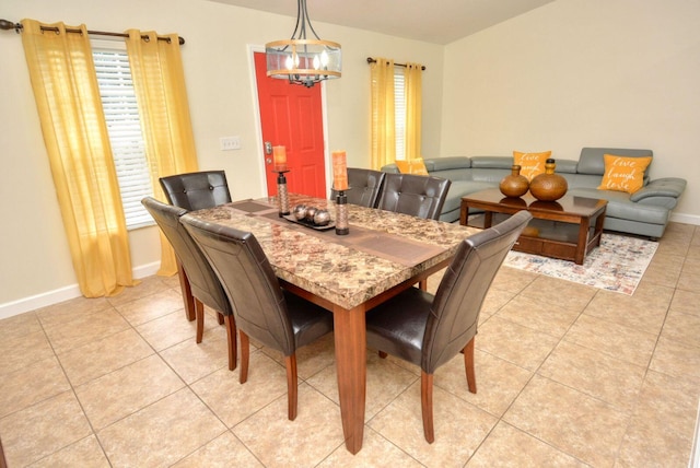 dining space featuring light tile patterned floors