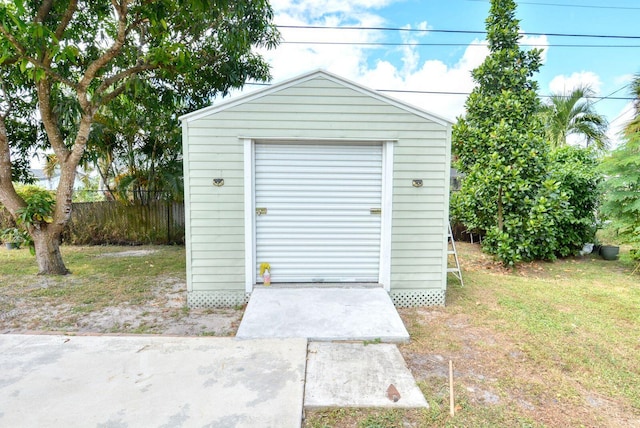 view of shed featuring fence