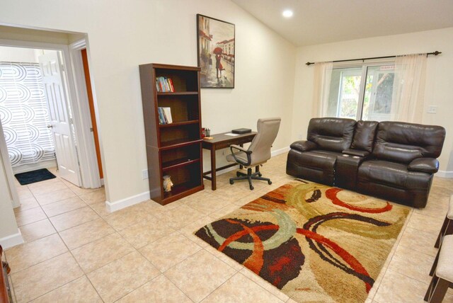 home office featuring high vaulted ceiling and light tile patterned flooring