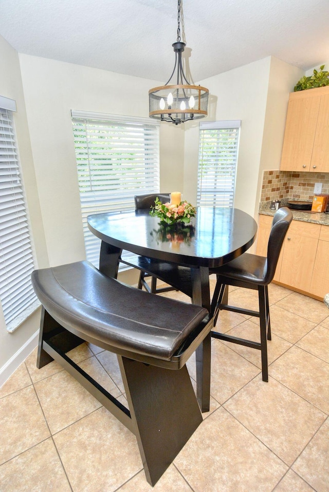 dining room featuring light tile patterned flooring and a wealth of natural light