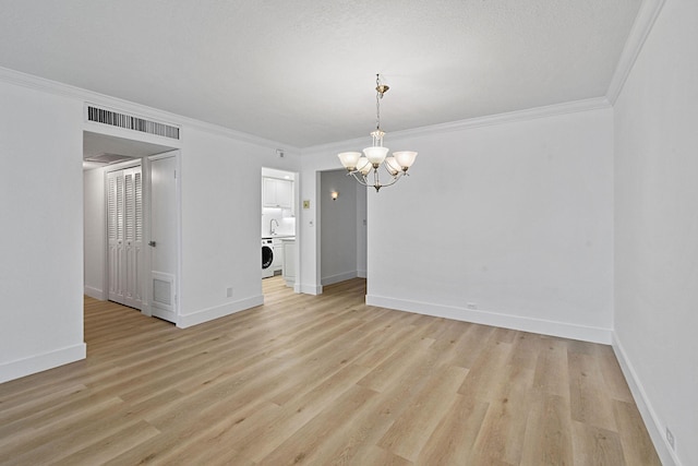 unfurnished dining area featuring a notable chandelier, light hardwood / wood-style floors, and crown molding