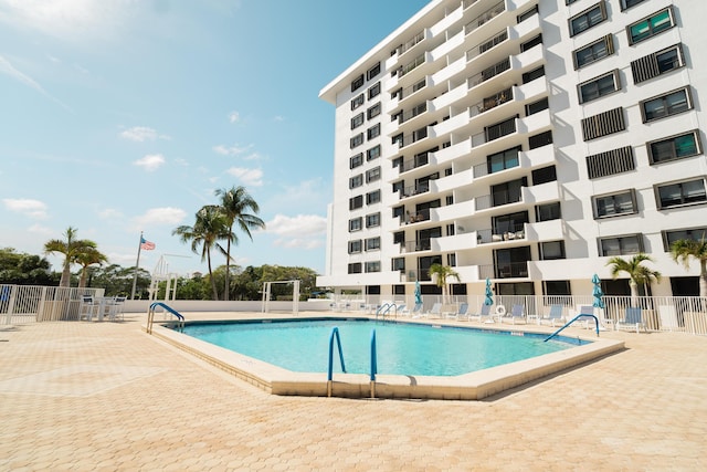 view of swimming pool with a patio