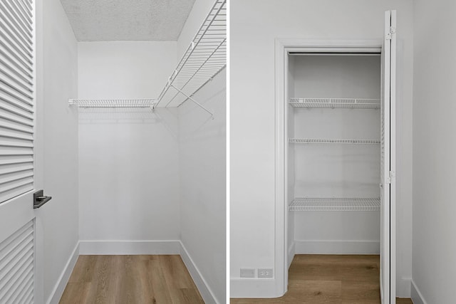 walk in closet with hardwood / wood-style floors