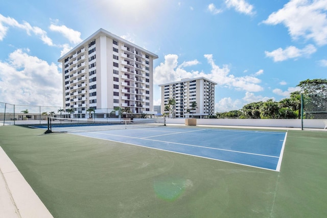 view of tennis court featuring basketball court