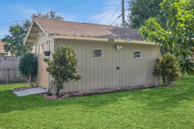 view of property exterior with a yard and a storage shed