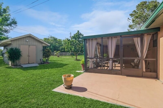 view of yard with a sunroom and a patio