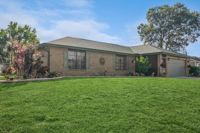 ranch-style house with a front yard and a garage