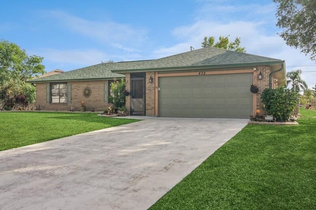 single story home with a garage and a front lawn