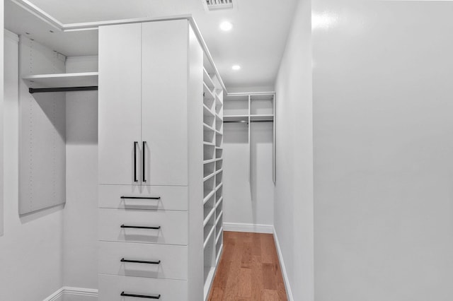 spacious closet with visible vents and light wood-style floors