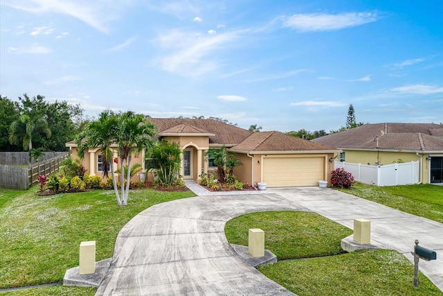 view of front of home featuring a garage and a front lawn