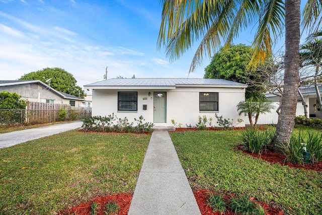 611 Monceaux Rd, West Palm Beach, FL 33405 - view of front of property featuring stucco siding and metal roof