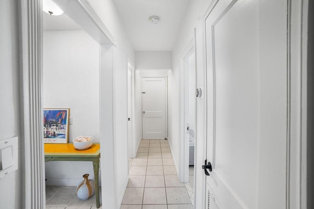 corridor with light tile patterned floors