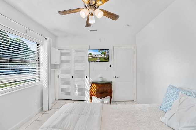 611 Monceaux Rd, West Palm Beach, FL 33405 - bedroom featuring light tile patterned flooring, a closet, ceiling fan, and baseboards