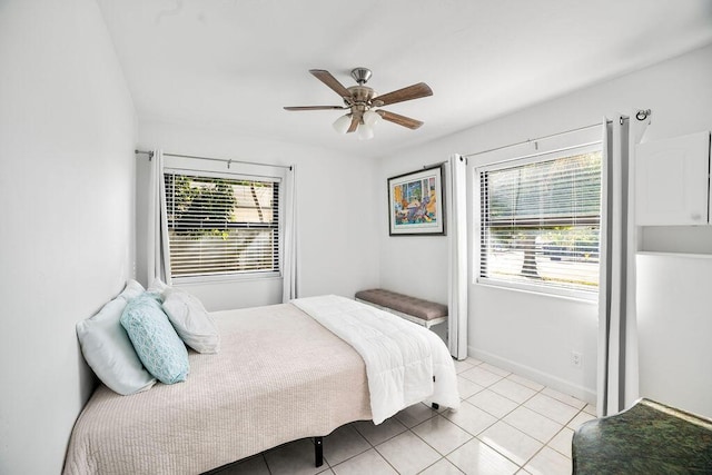 bedroom featuring ceiling fan and light tile patterned floors