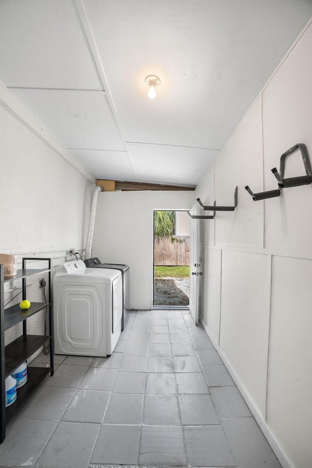 washroom featuring washer and clothes dryer