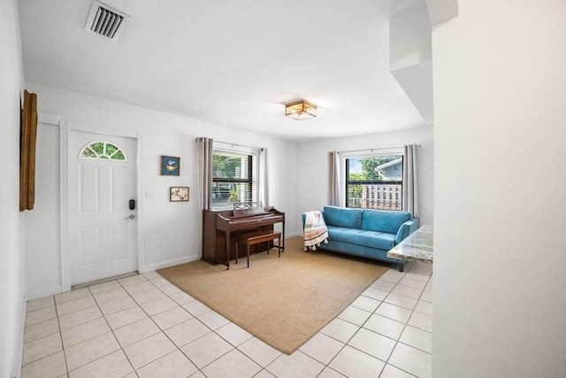 tiled living room featuring plenty of natural light