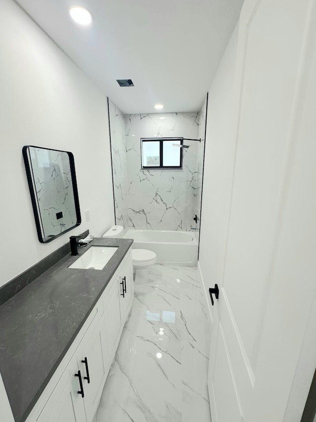 full bathroom featuring vanity, toilet, and tiled shower / bath combo