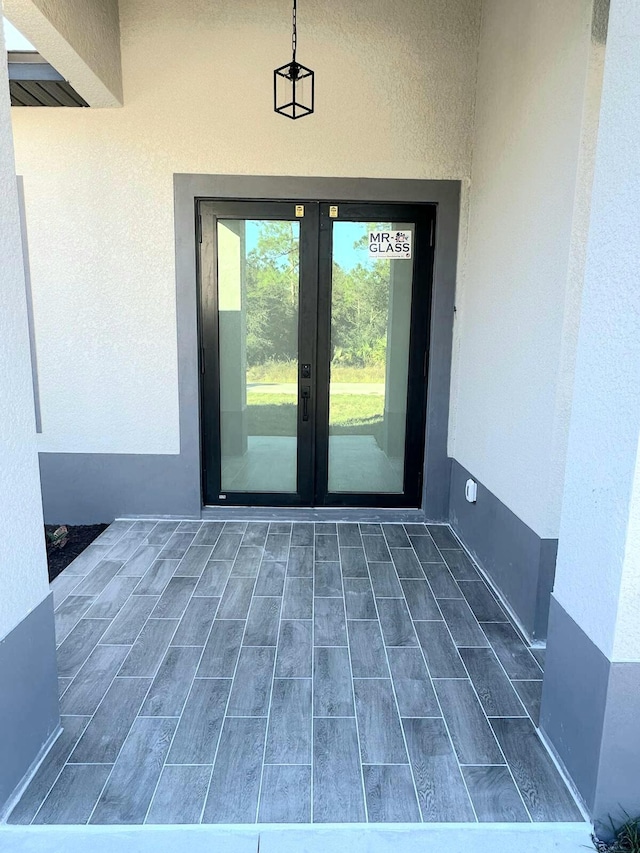 entrance to property featuring french doors