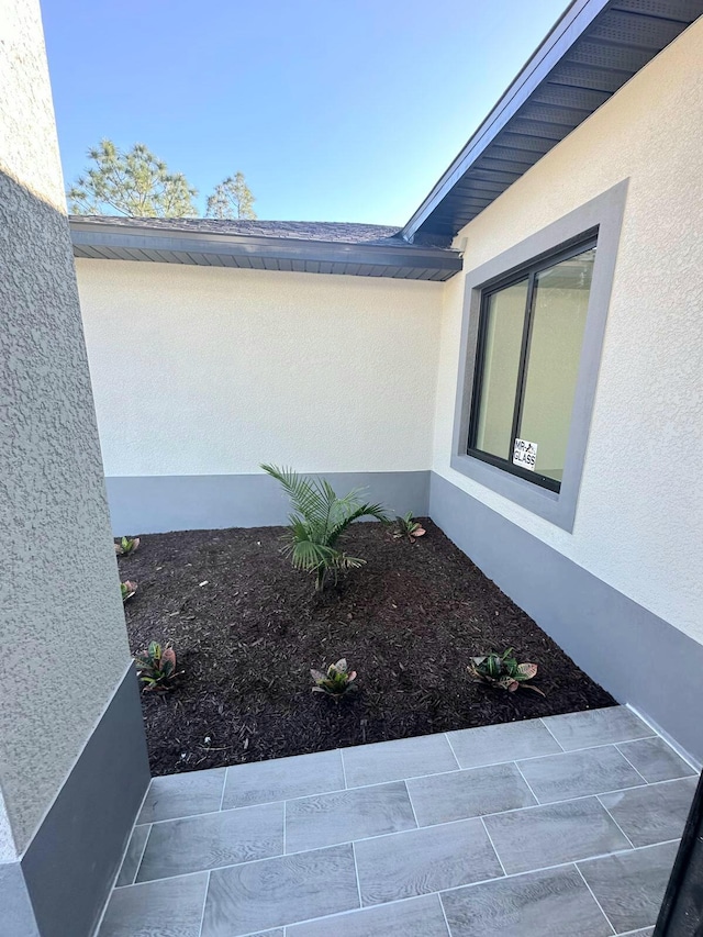 view of property exterior featuring a patio