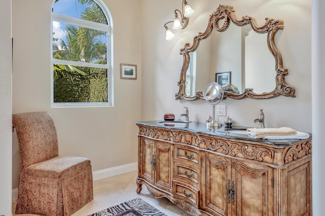 bathroom with tile patterned flooring and vanity