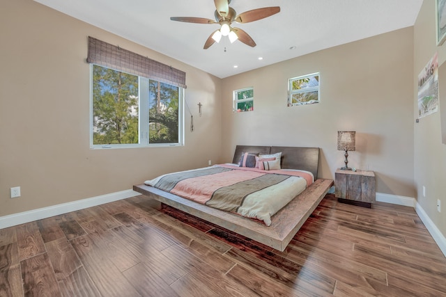 bedroom featuring ceiling fan and hardwood / wood-style flooring