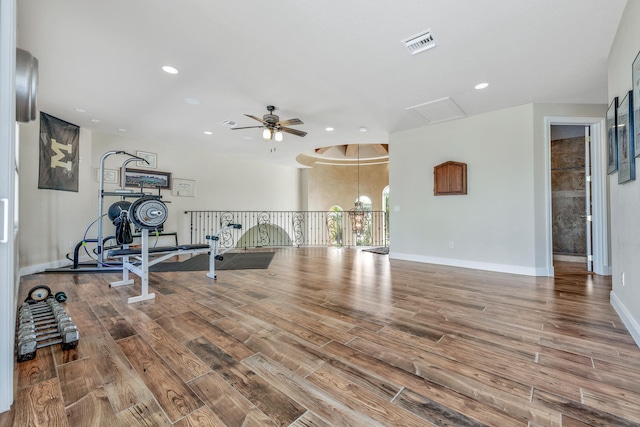 workout area featuring ceiling fan and wood-type flooring