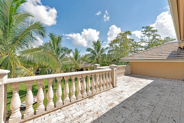 view of patio featuring a balcony