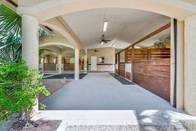 exterior space featuring ceiling fan