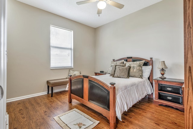 bedroom featuring ceiling fan and dark wood-type flooring