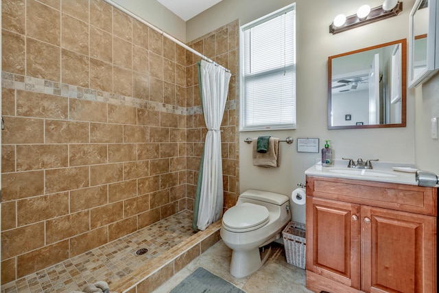 bathroom featuring a shower with curtain, tile patterned flooring, vanity, and toilet