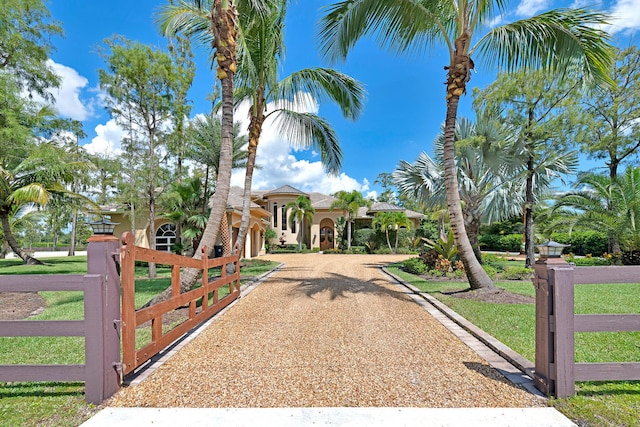 mediterranean / spanish-style home featuring a front lawn