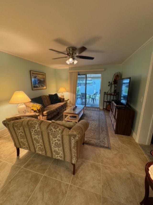 tiled living room featuring ceiling fan and crown molding