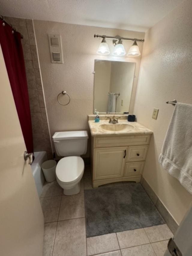 full bathroom featuring tile patterned floors, vanity, toilet, and shower / bath combo