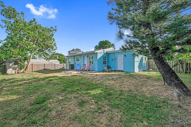 exterior space featuring a yard and a storage shed