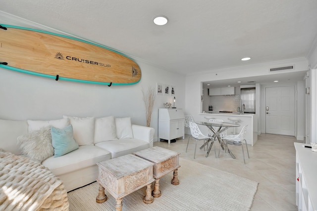 living room featuring crown molding