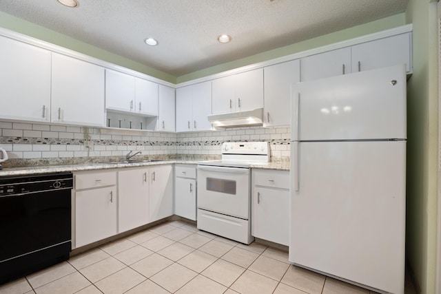 kitchen featuring decorative backsplash, sink, white cabinets, and white appliances