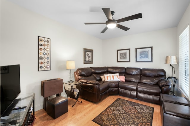 living room with hardwood / wood-style floors and ceiling fan