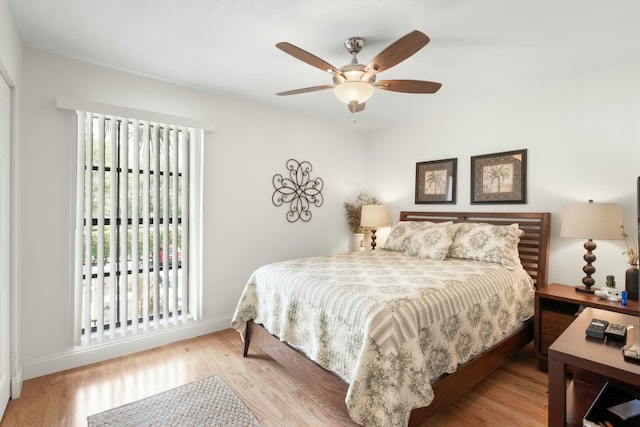 bedroom featuring ceiling fan and light hardwood / wood-style flooring