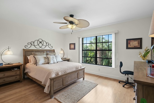 bedroom featuring light hardwood / wood-style floors and ceiling fan