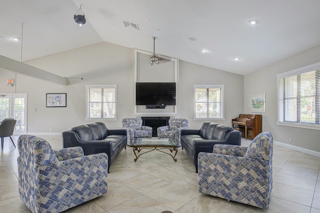 tiled living room featuring vaulted ceiling