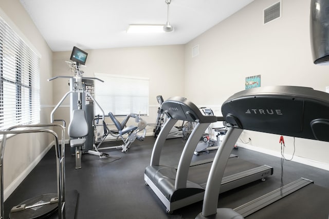 workout area with lofted ceiling