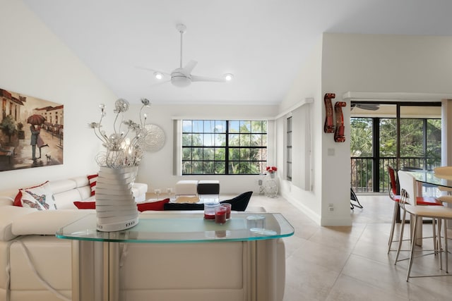 living room with light tile patterned floors, ceiling fan, and lofted ceiling