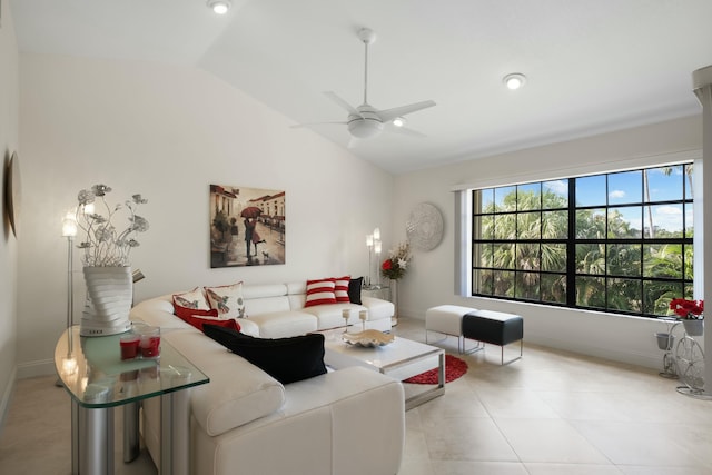 living room featuring ceiling fan, lofted ceiling, and light tile patterned floors