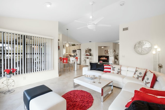 living room featuring ceiling fan, light tile patterned floors, and high vaulted ceiling