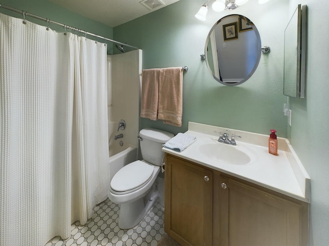 full bathroom with tile patterned flooring, shower / tub combo, vanity, and toilet