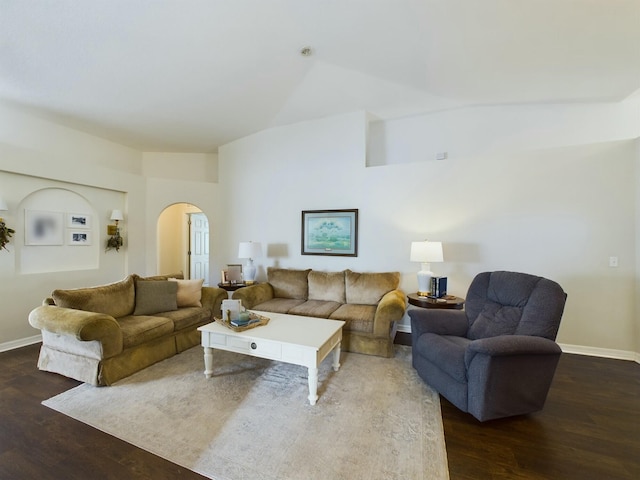 living room with lofted ceiling and dark wood-type flooring