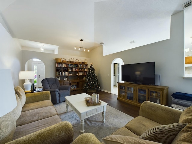 living room featuring hardwood / wood-style floors and vaulted ceiling