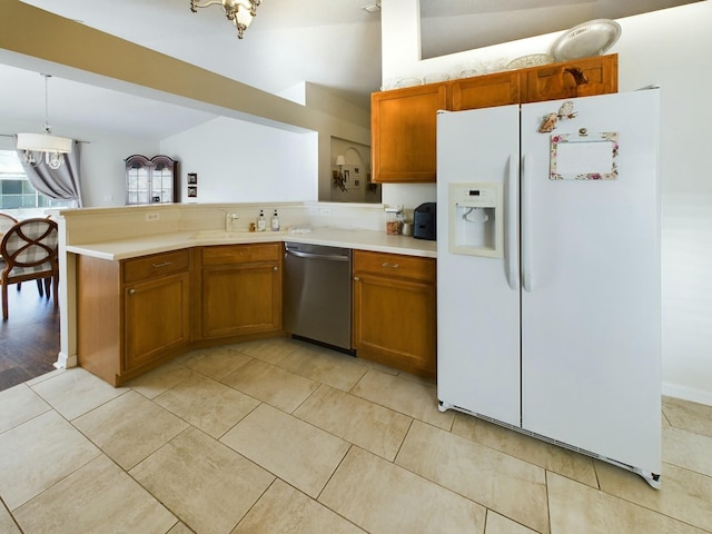 kitchen with dishwasher, vaulted ceiling, white fridge with ice dispenser, decorative light fixtures, and kitchen peninsula