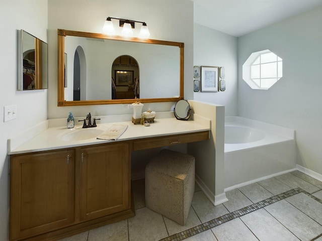 bathroom with vanity, tile patterned floors, and a bathtub